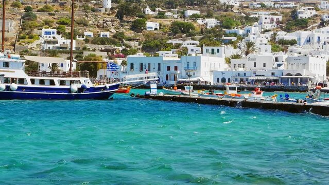 Cruise ship anchored at anchor in Myconos. Shuttle disembarks tourists at the port