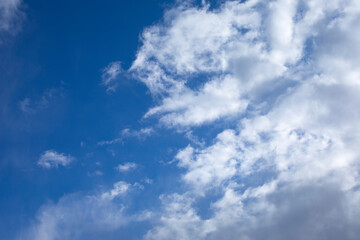 cloudscape with cirrus clouds on blue sky, natural background