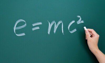 Einstein equation emc2 handwritten chalk on blackboard