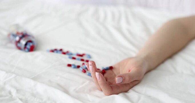 Drug overdose suicide and death surrounded by many pills