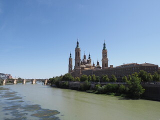 Basilica of Our Lady of the Pillar and bridge in Saragossa city, Spain
