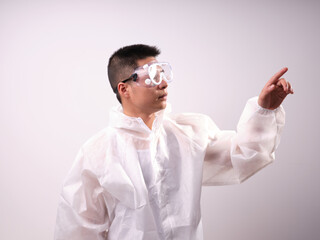A health care worker wearing a mask and protective clothing on a solid color background