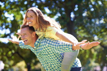 Obraz premium Playful in the summer sun. Shot of a playful couple enjoying the summer sun.