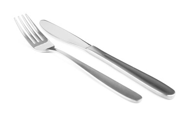 Shiny fork and knife on white background