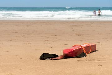 Lifebuoy float on the beach sand