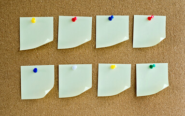 Many blank post notes on cork