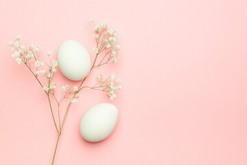 Eggs with gypsophila on a pink background. Happy Easter concept. Minimal concept.