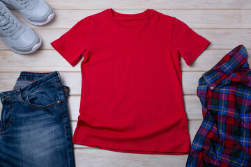 Unisex red T-shirt mockup with trainers and jeans