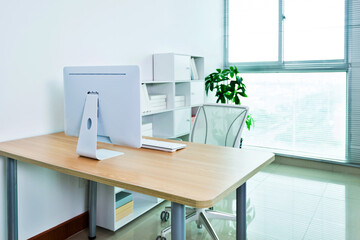 Modern workspace with computer and chair