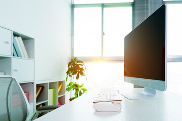 Modern workspace with computer and chair