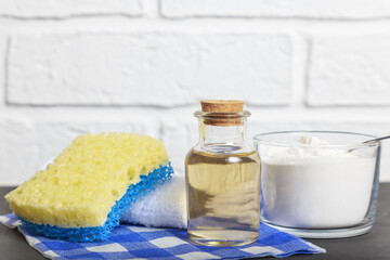 Apple cider vinegar, baking soda, scouring pad. Cleaning agent. Conceptual way for home cleaning