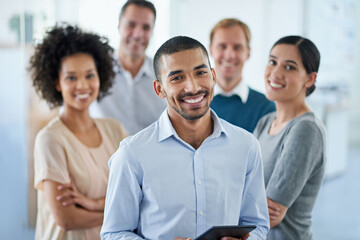 All set for success. Portrait of a group of diverse colleagues standing in an office.