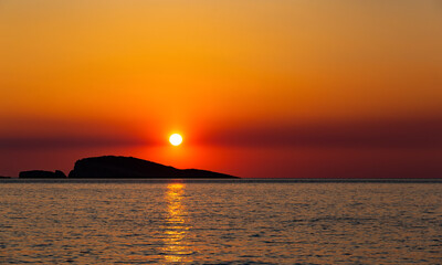 Fototapeta na wymiar Orange sunset over s sea