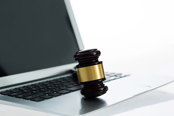 Judge gavel on laptop computer keyboard