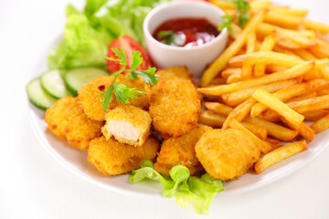 fried chicken nugget and french fries