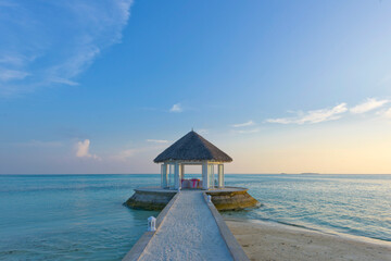 Romantic dinner place in a tropical hut on the water paradise in Maldives.