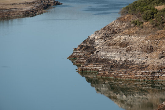 Stones and moss on the river bank. Landscape. River and forest in the taiga.