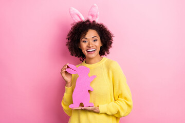Obraz na płótnie Canvas Photo of pretty excited woman dressed kitted pullover easter headband holding rabbit isolated pink color background