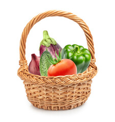 basket with fresh vegetables isolated on white. onion, zucchini, tomato, cucumber and green bell pepper.