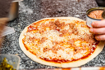 hand of chef baker making pizza at kitchen. The process of making pizza. cooking italian pizza