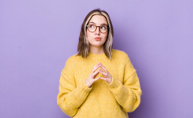 pretty caucasian woman scheming and conspiring, thinking devious tricks and cheats, cunning and...
