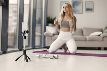 Fototapeta premium Girl in a sports uniform make yoga at home
