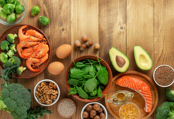 Close up of Omega 3 rich foods on wooden table, directly above. Copy space