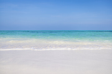 Sea sand sky on a summer day. Tranquil nature scene, closeup amazing blue sea with horizon and blue sky. Idyllic tropical island shore, coast landscape. Beautiful exotic beach, travel vacation concept