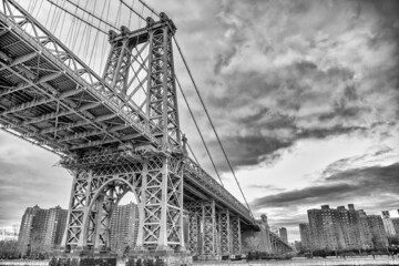 The Manhattan Bridge in New York City as seen from a ferry boat navigating East River.