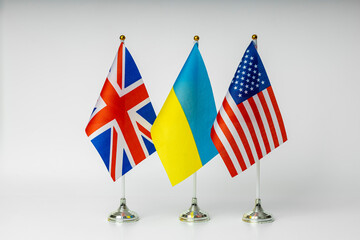 National flags of Great Britain, USA and Ukraine on a light background. State flags.
