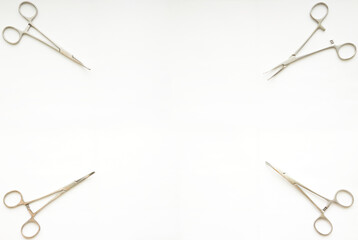 cramp forceps on corner of white copy space