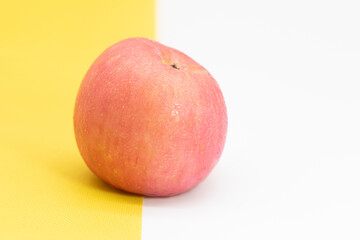 apple isolate on yellow background, front view