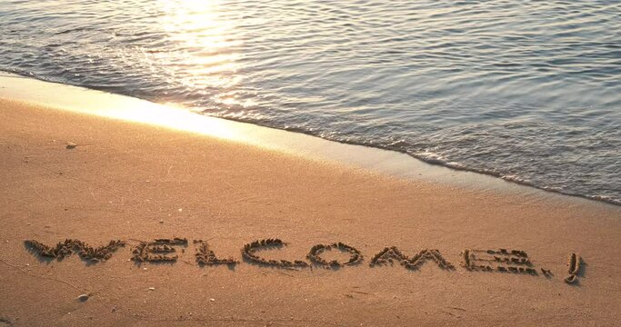Welcome the sea waves. The black sea welcome the people on the beach. Waves washes word on the beach.