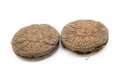 Two chocolate color biscuit with cream isolated on white
