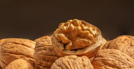 Ripe Walnuts Wallpaper.  Walnut fresh nuts on black Background side view