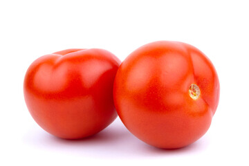 Two Juicy red tomatoes isolated on a white background.