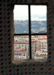 Fototapeta na wymiar Overlooking Naples, Italy, from a window in Castle Sant Elmo