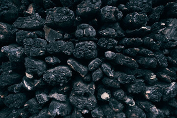 A pile of charred wood after a fire. Burnt wood