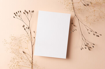 Wedding invitation or greeting card mockup with dry nature plants twigs