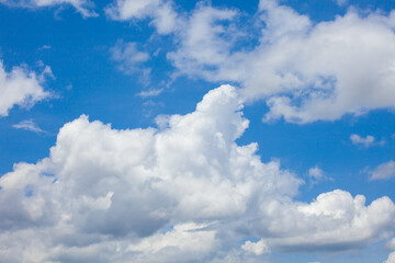 Naklejka na ściany i meble Natural daylight and white clouds floating on blue sky. Concept of freedom and relaxation.