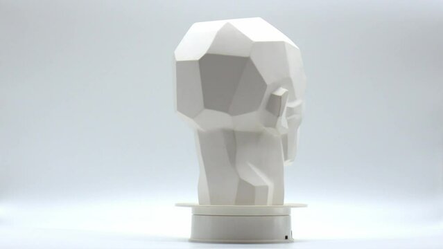 Rotating head made of plaster. Creative work of art. Screensaver