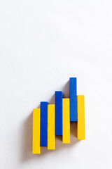 top view of colorful blue and yellow blocks on white background with copy space, ukrainian concept.
