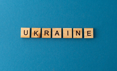 Ukraine background. Phrase from wooden letters. Top view words. The phrases is laid out in wood letter. Motivation.
