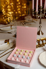 Assortment of luxury chocolate bonbons in box on a table.