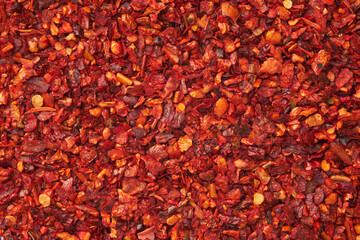 Dried paprika and hot pepper flakes. Organic spices background. Pepper and paprika seasoning  texture closeup.