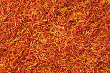 Saffron seasoning background. Organic Saffron or alternative to saffron - Safflower spice texture closeup.