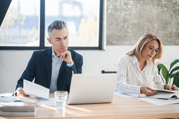 Two colleagues working together in the office