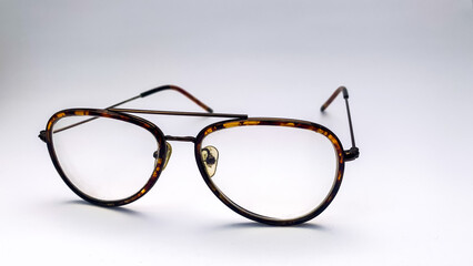 Fototapeta premium striped eyeglasses with a white background. These glasses are usually used when in front of the computer or just reading a book.