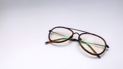 striped eyeglasses with a white background. These glasses are usually used when in front of the computer or just reading a book.