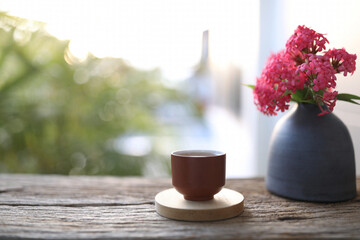 earthenware tea cup and vase of Panama Rose
